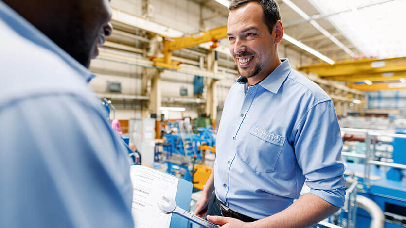 Coperion service technicians discussing project