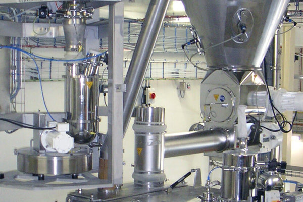 Coperion K-Tron feeders over mixer in infant formula application