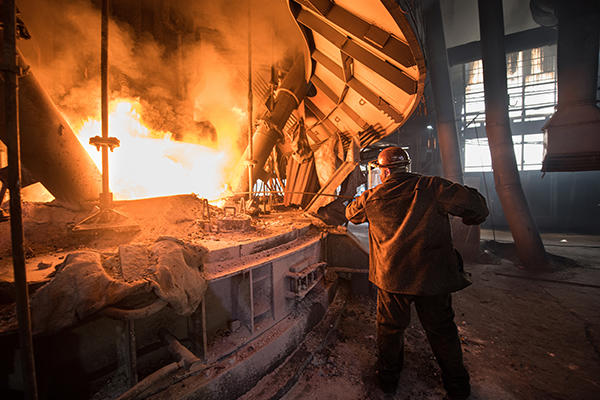 Steelworker Work Near Arc Furnace 