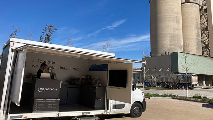 open Coperion show van in front of a factory